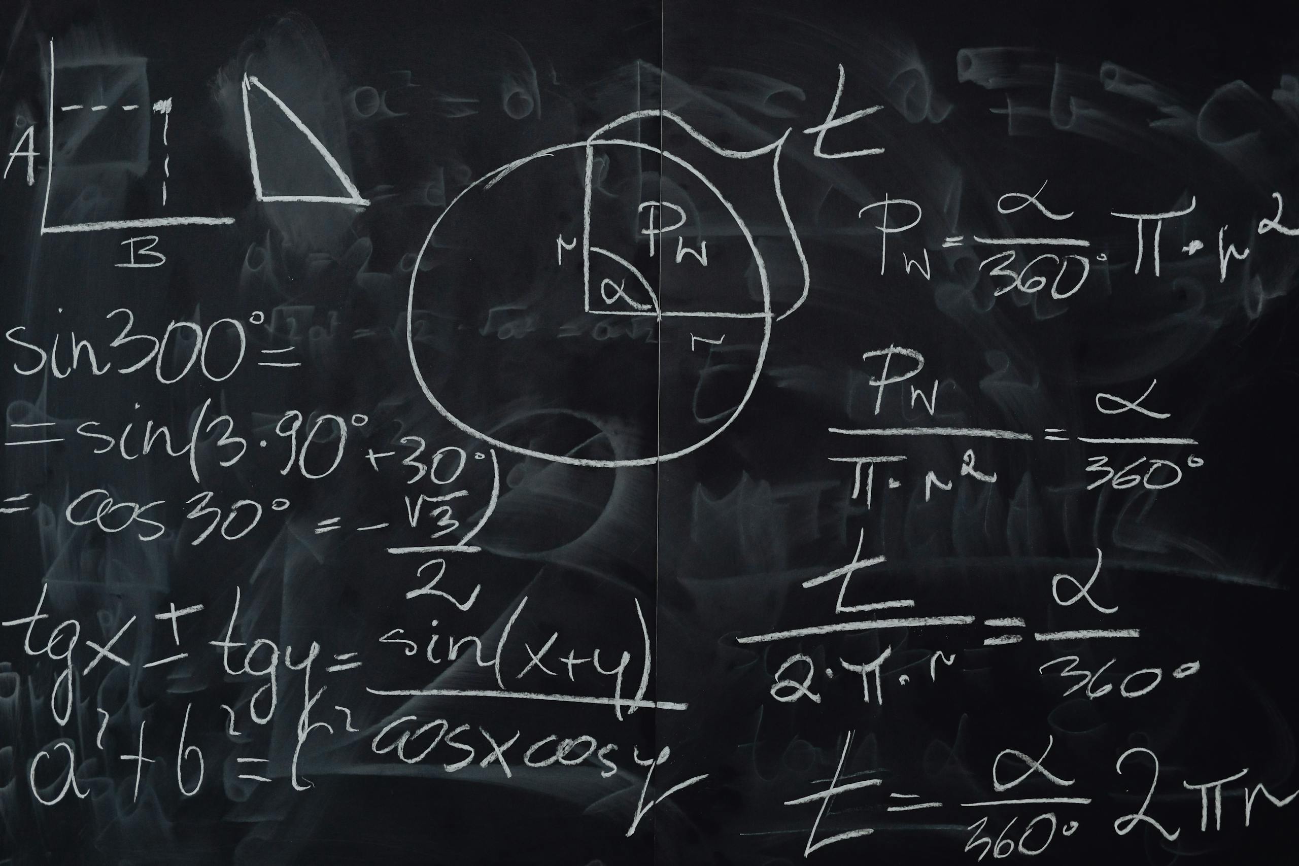 Complex trigonometric equations and geometric diagrams drawn on a classroom blackboard.